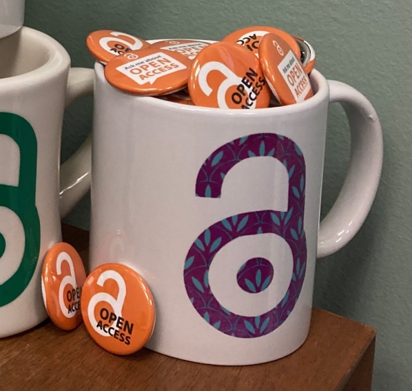 Mug with open access logo filled with open access buttons